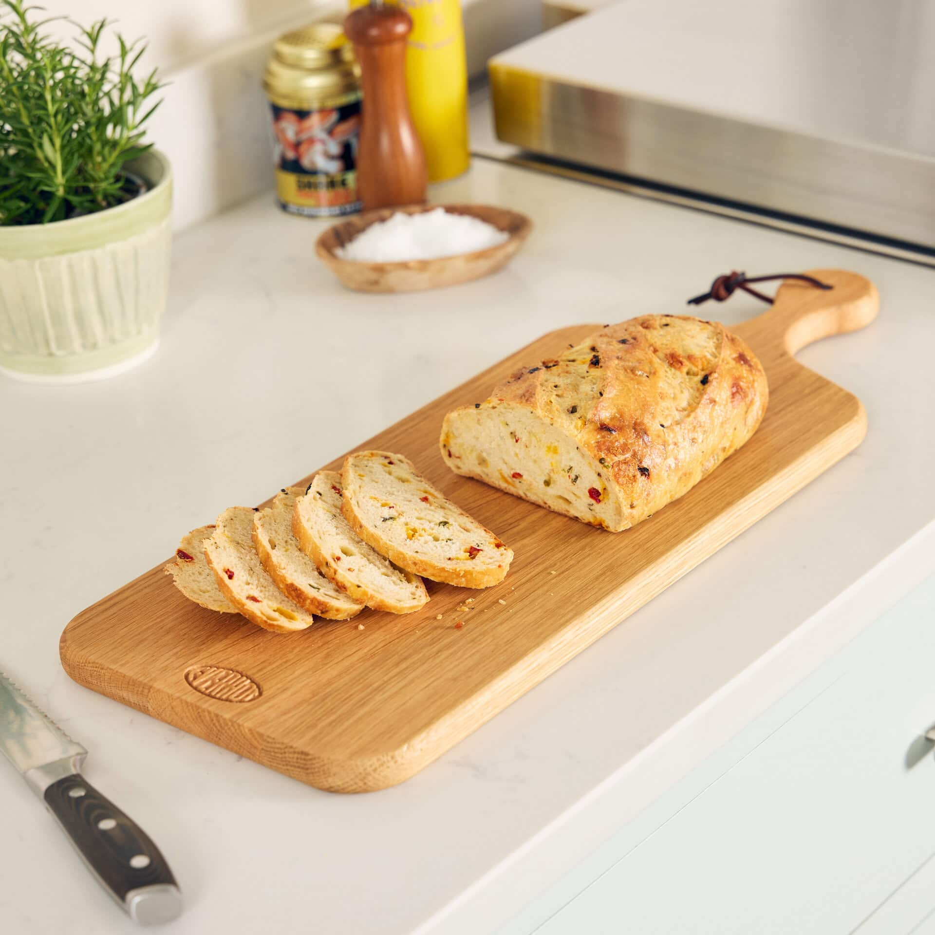 Everhot Oak Chopping Board - large, next to cooker with bread